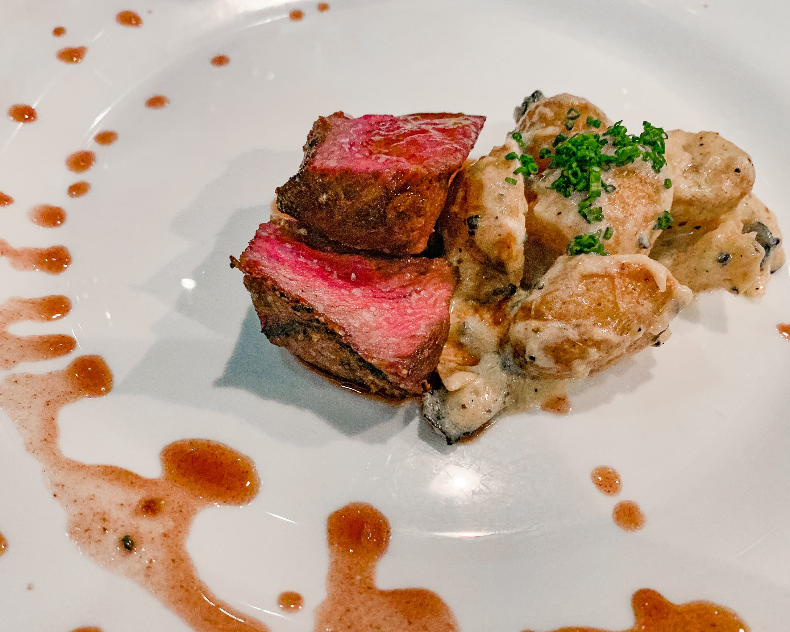 Grilled Wagyu Beef with warm dijon fingerling potatoes and black truffles.