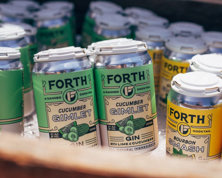 forth brand canned cocktails in a bucket of ice at bend farmers market