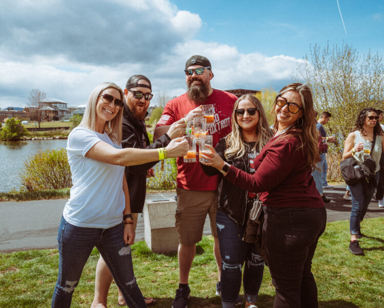 five friends cheers their beers in the old mill district during bend brewfest