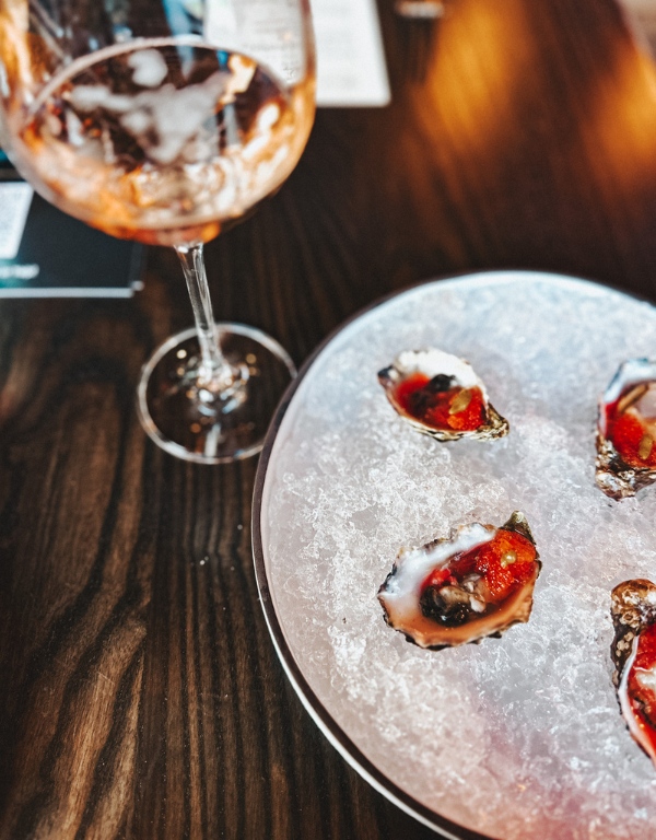 sparkling rosé paired with shucked oysters on the half shell.